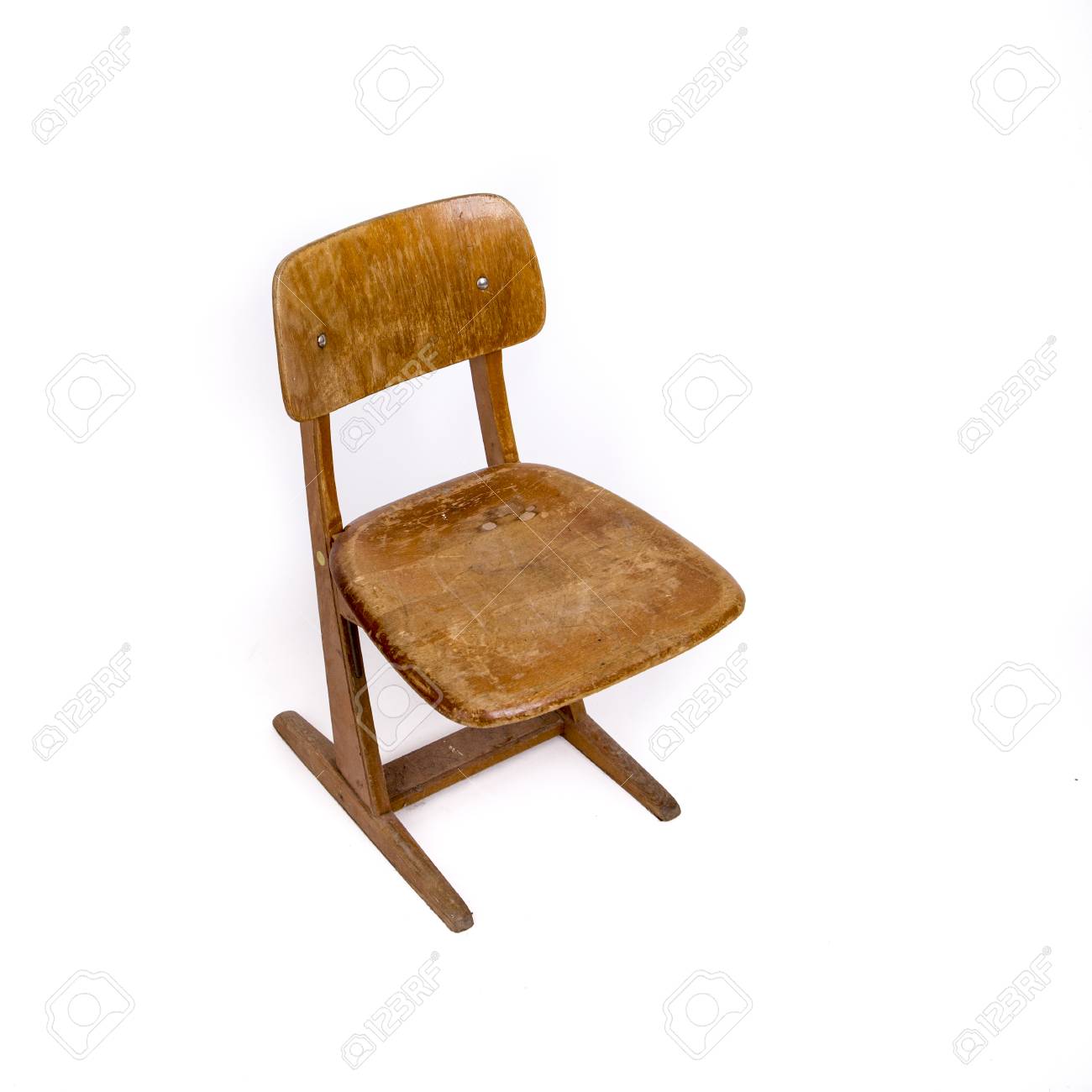 old wooden chair for children used at primary school stock photo