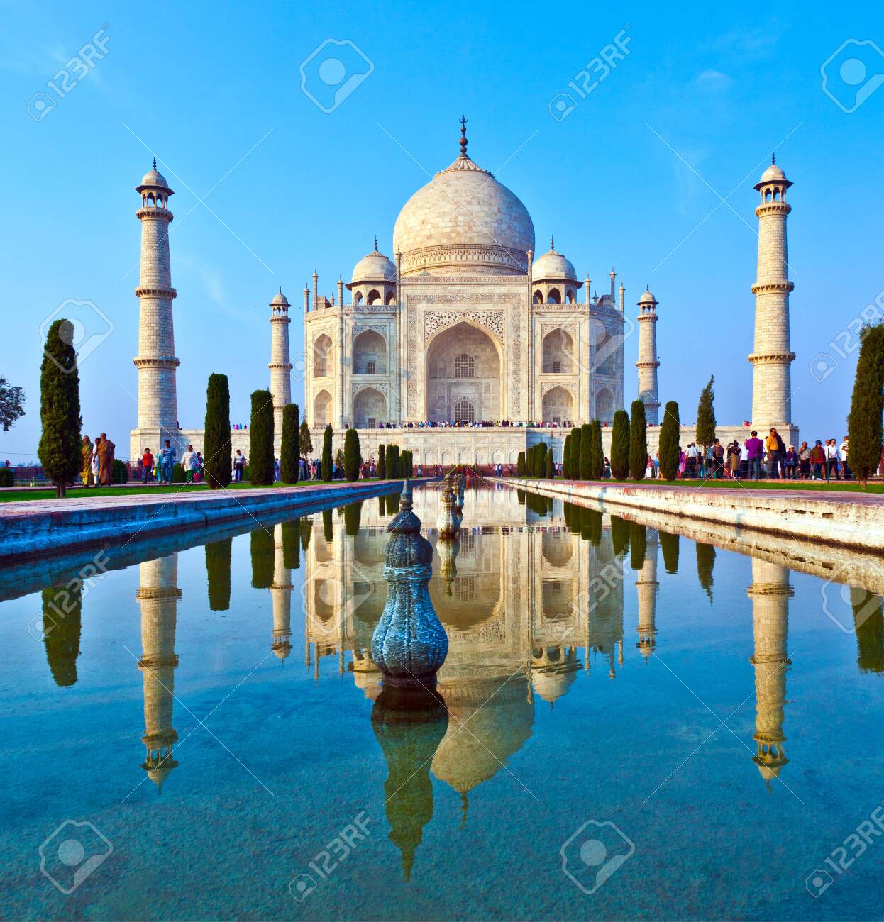 AGRA, INDIA - NOV 15, 2011: people visit beautiful Taj Mahal in India with blue sky - 140145422 AGRA, INDIA - NOV 15, 2011: people visit beautiful Taj Mahal in India with blue sky - 140145422