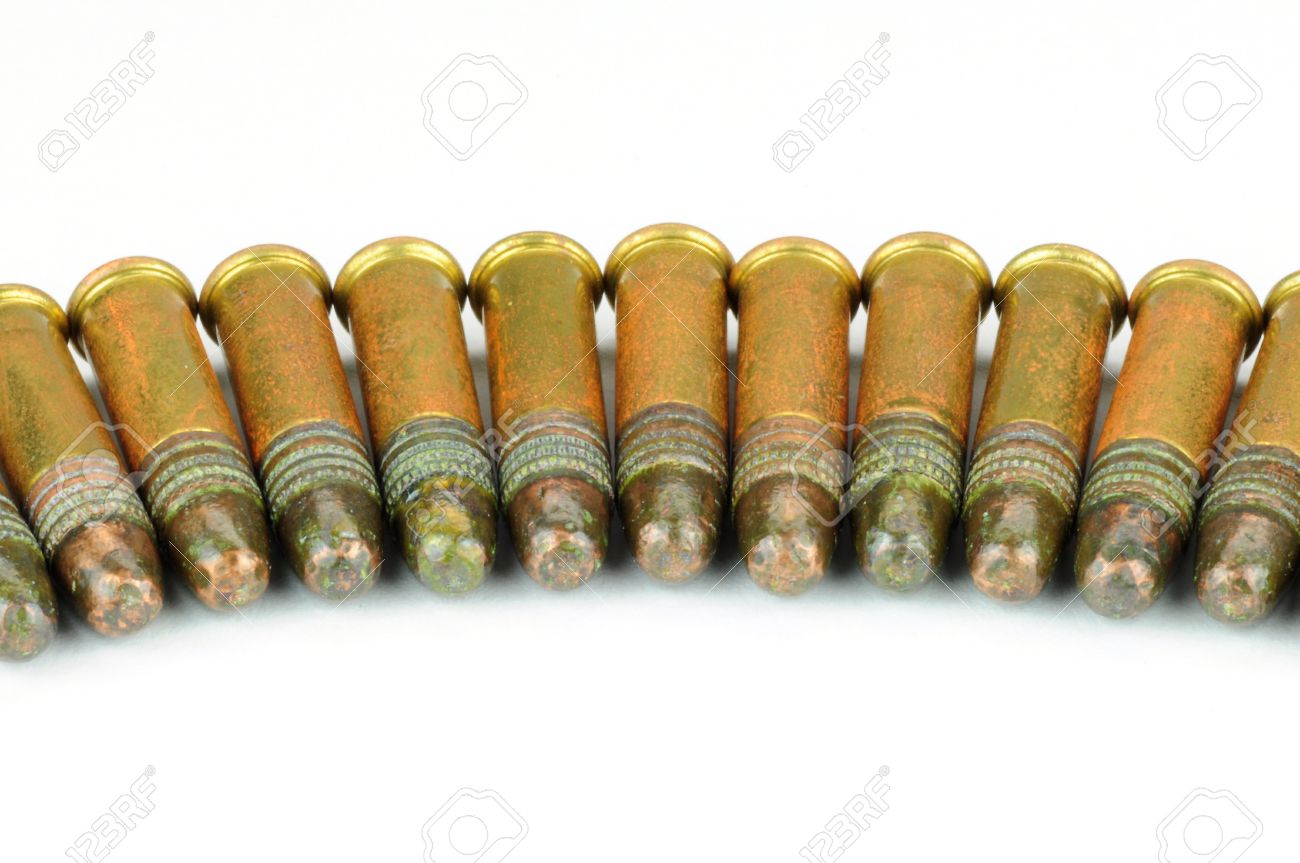 several 22 caliber rifle rounds on white stock photo picture and