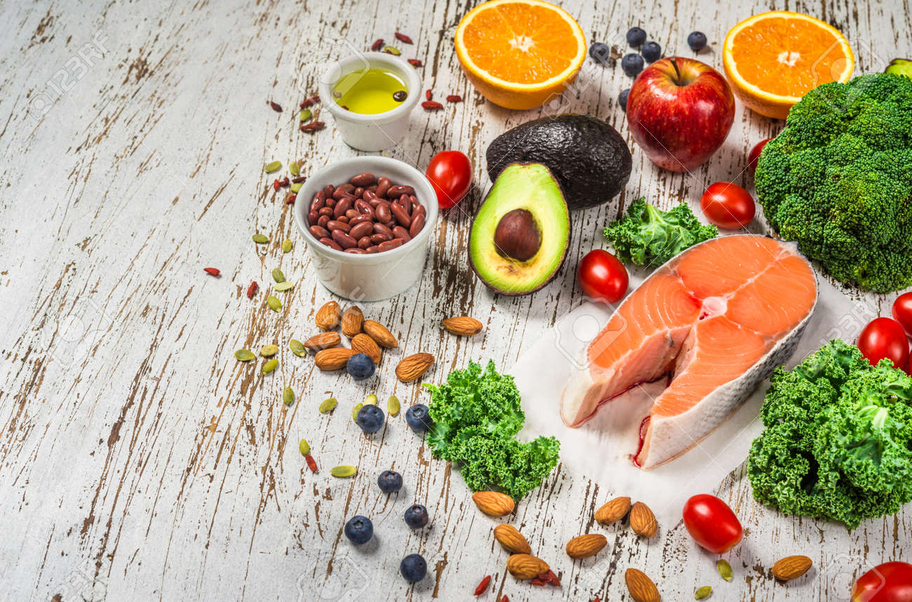 Selection of fresh fruit and vegetables, salmon, beans, and nuts. - 131290734 Selection of fresh fruit and vegetables, salmon, beans, and nuts. - 131290734