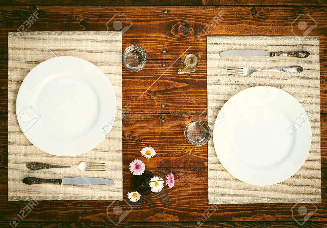 Table setting for two with empty plates - rustic wooden table - 40213901 Table setting for two with empty plates - rustic wooden table - 40213901