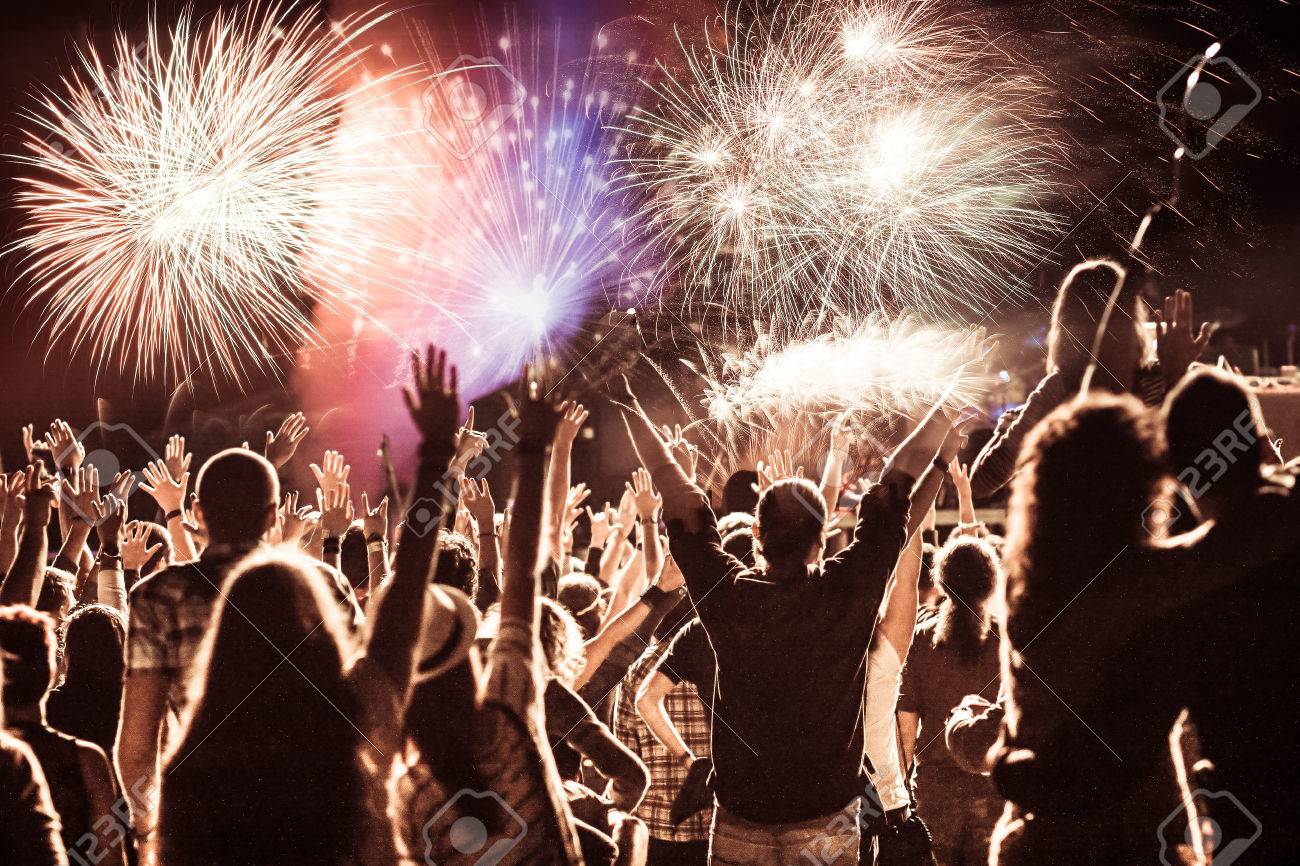 cheering crowd watching fireworks at New Year - holiday celebration background - 69756051 cheering crowd watching fireworks at New Year - holiday celebration background - 69756051