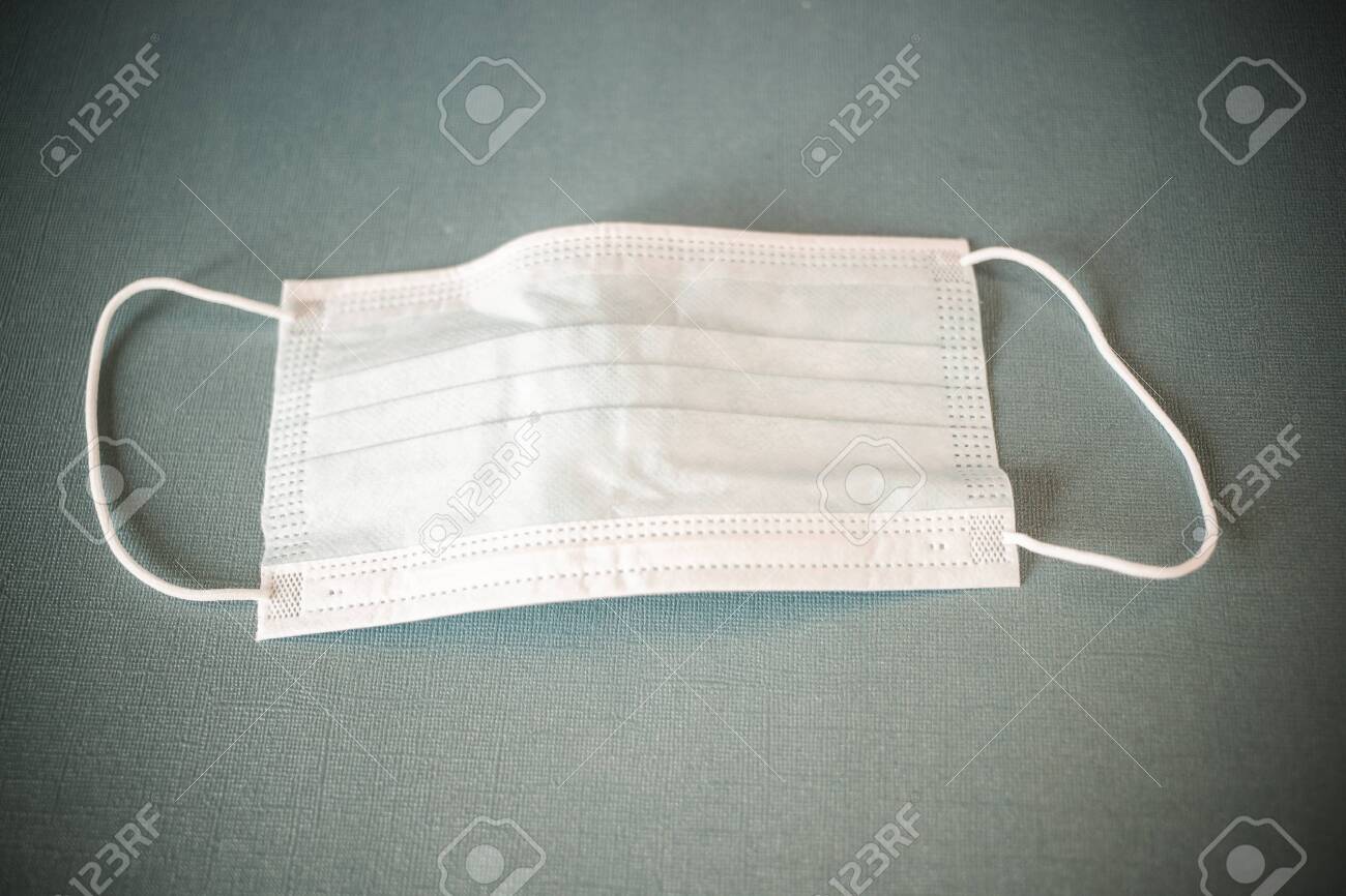 coronavirus world alert surgical mask on blue - 141457496 coronavirus world alert surgical mask on blue - 141457496