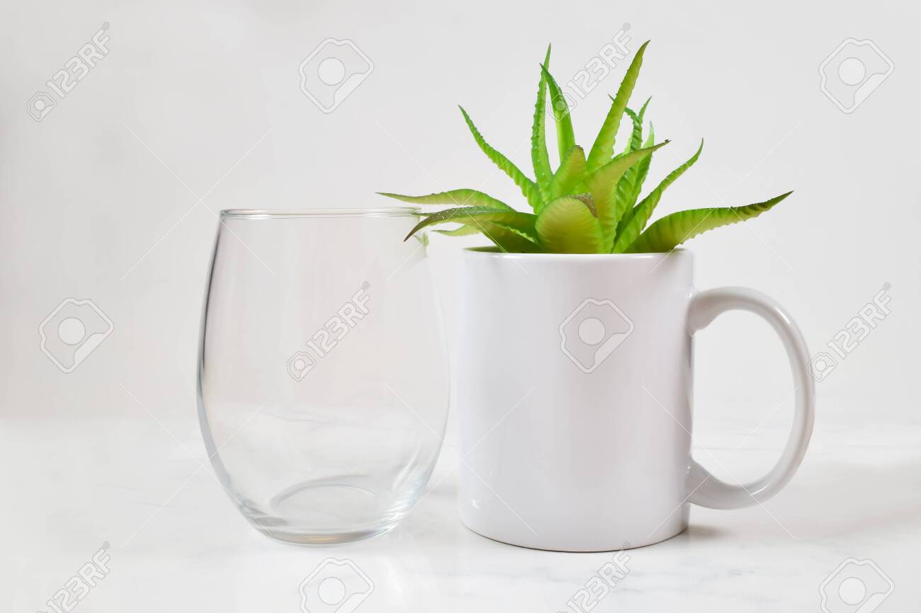 Download This Cup Mockup Features A Stemless Wine Glass Next To An 11 Stock Photo Picture And Royalty Free Image Image 142207305