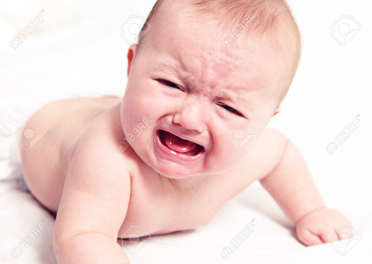 Little baby girl crying on white blanket - 12010415 Little baby girl crying on white blanket - 12010415