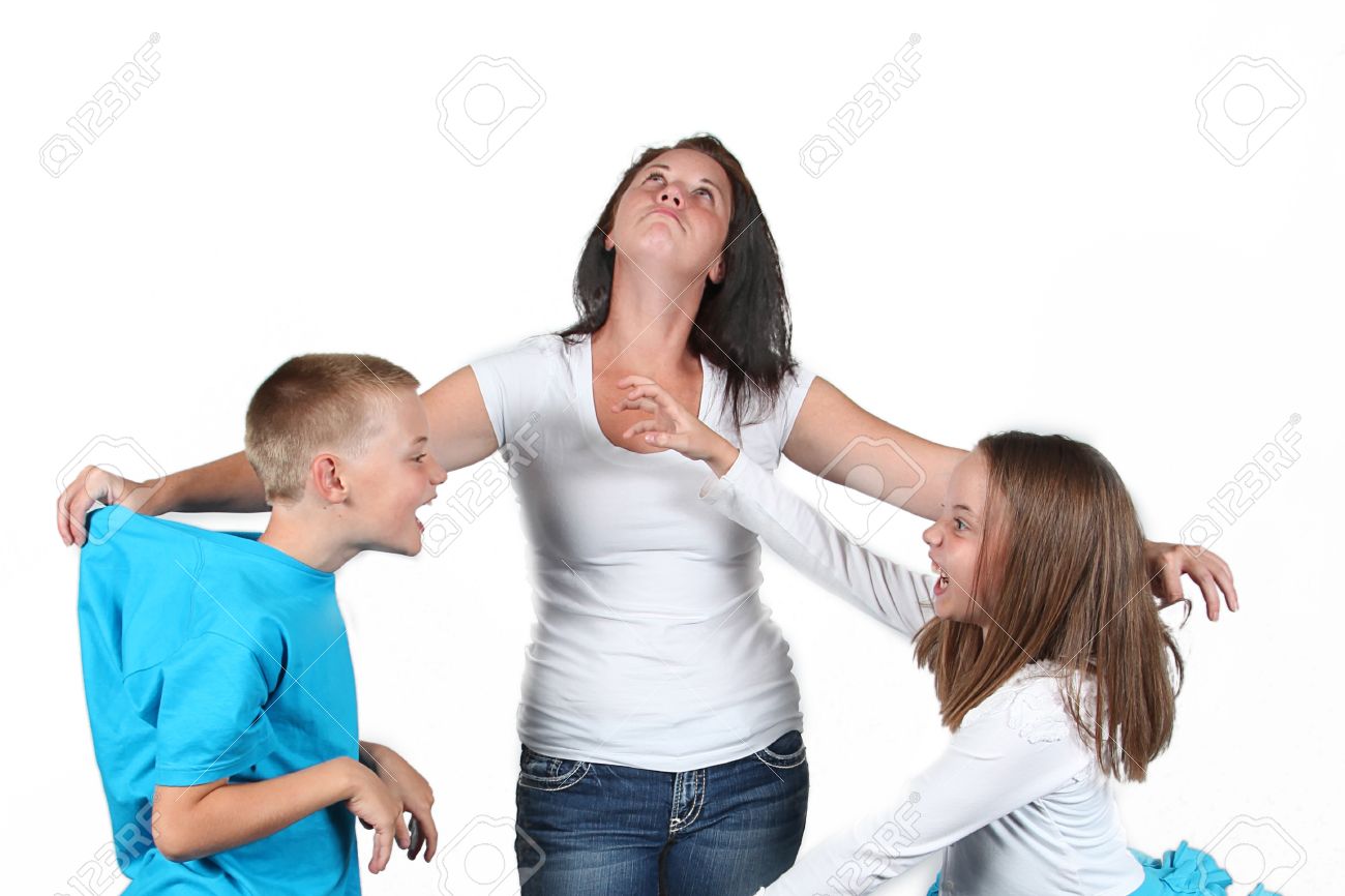 Mother holding two kids as they fight with each other. - 33279882 Mother holding two kids as they fight with each other. - 33279882
