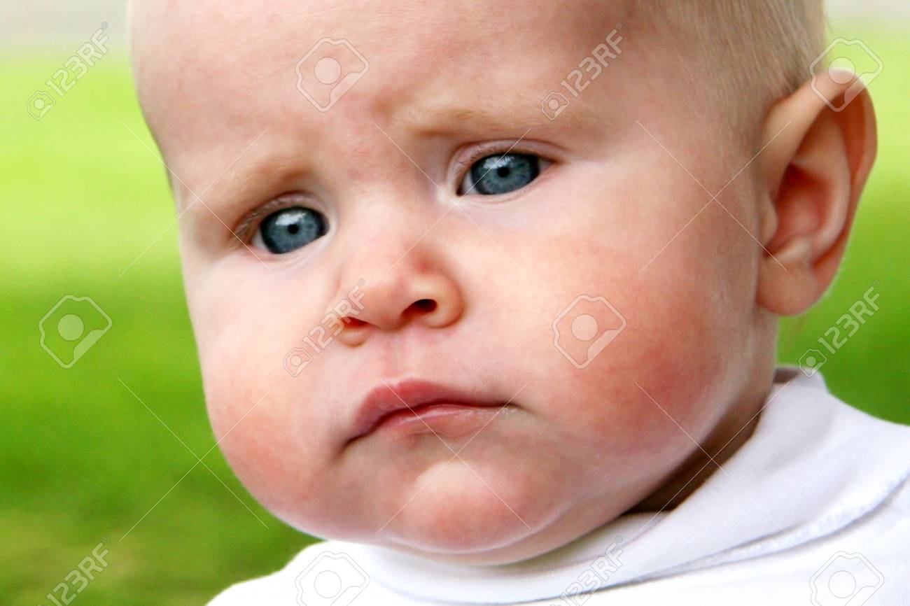 Baby Taken Closeup With Sad Face Stock Photo Picture And Royalty Free Image Image