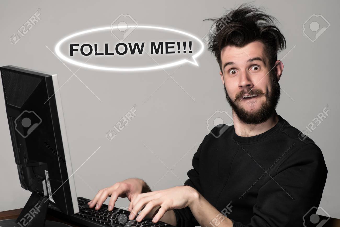 Funny And Crazy Blogger Using A Computer On Gray Background. Man's Hands On  The Keyboard. Follow Me Request Concept For Social Networking On Internet  Stock Photo, Picture and Royalty Free Image. Image, image size:1300x867