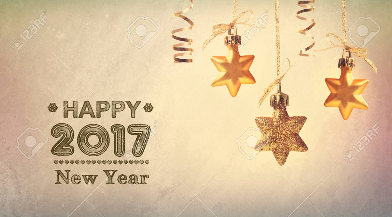 happy new year 2017 message with hanging star ornaments stock photo