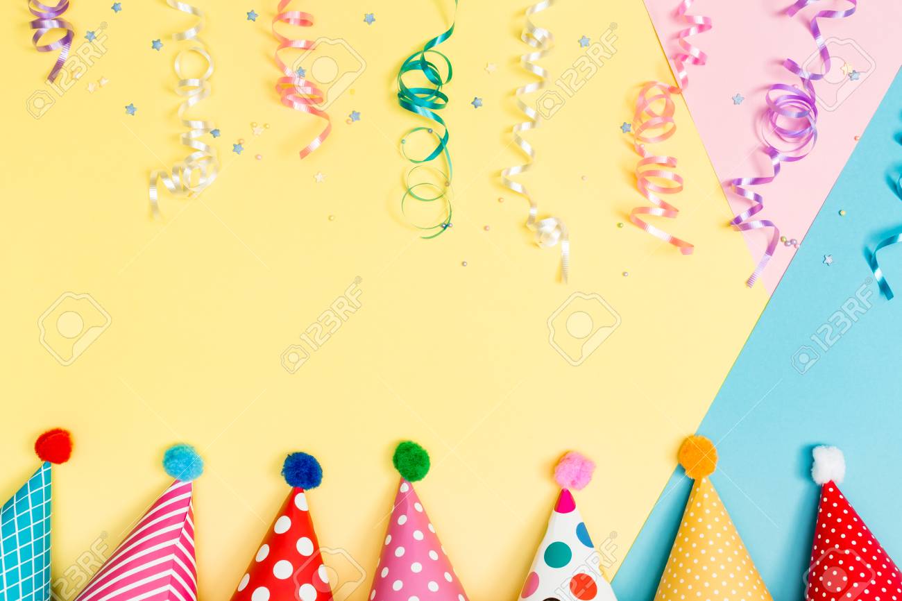 party theme with with hats and streamers on a vibrant background party theme background