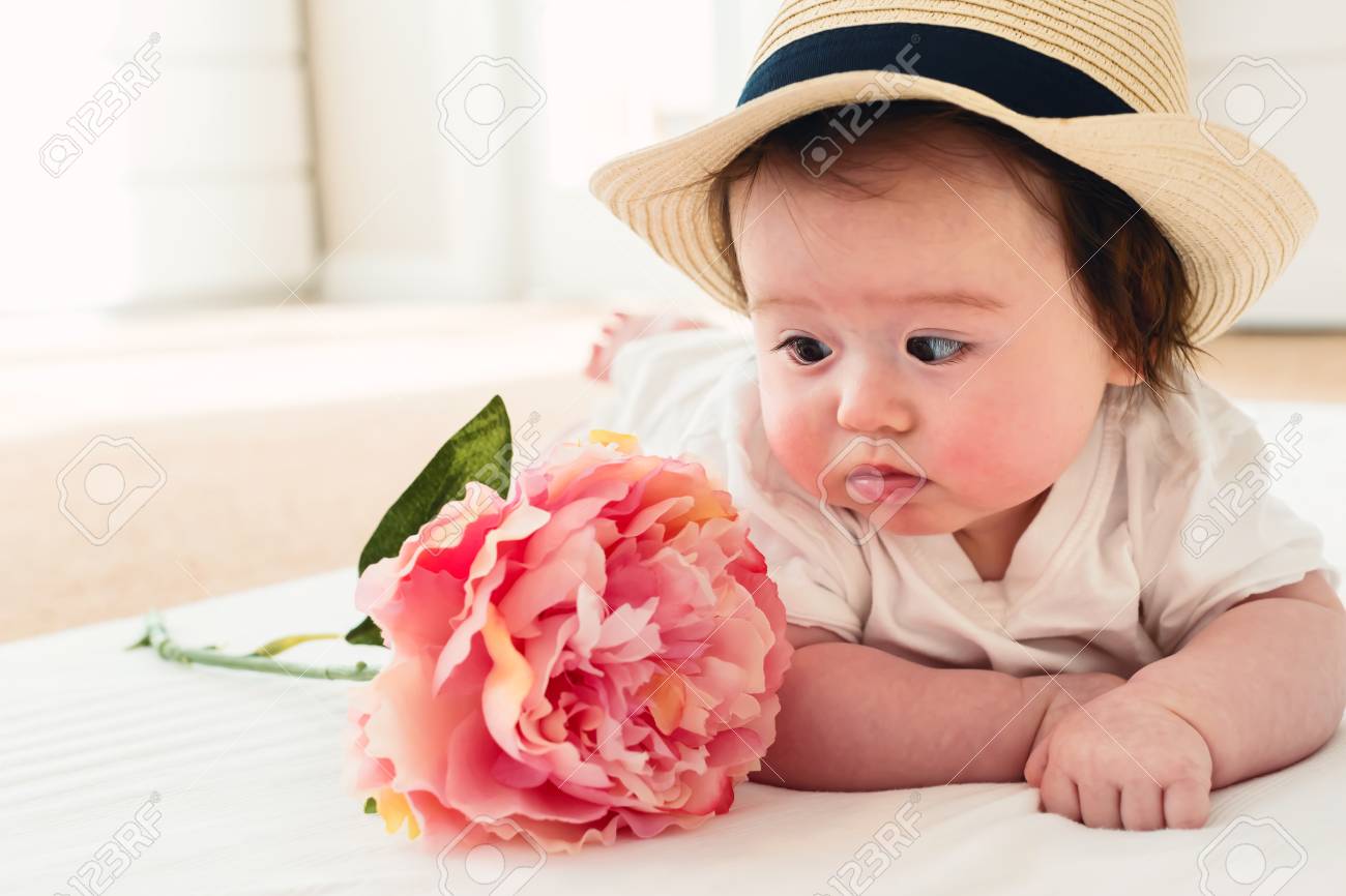 Happy Baby Boy With A Pink Flower Stock Photo Picture And Royalty Free Image Image Happy Baby Boy With A Pink Flower Stock Photo Picture And Royalty Free Image Image