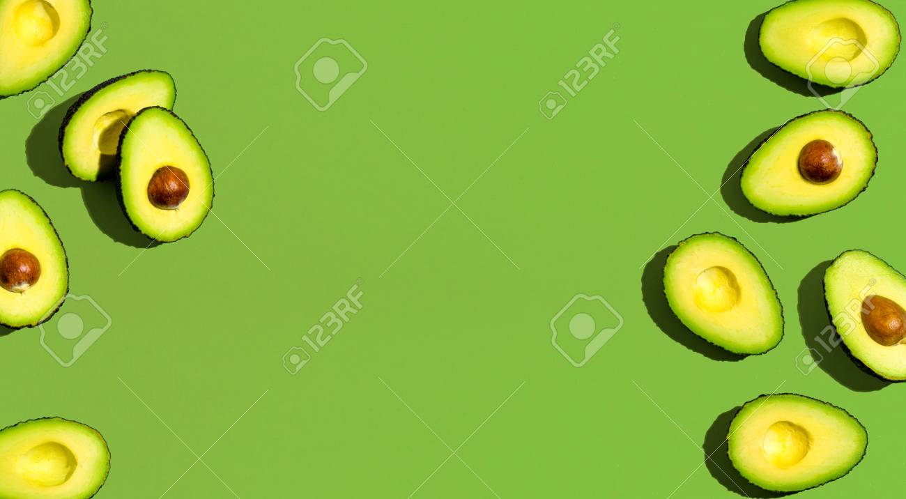 Fresh avocado pattern on a green background flat lay - 110707067 Fresh avocado pattern on a green background flat lay - 110707067