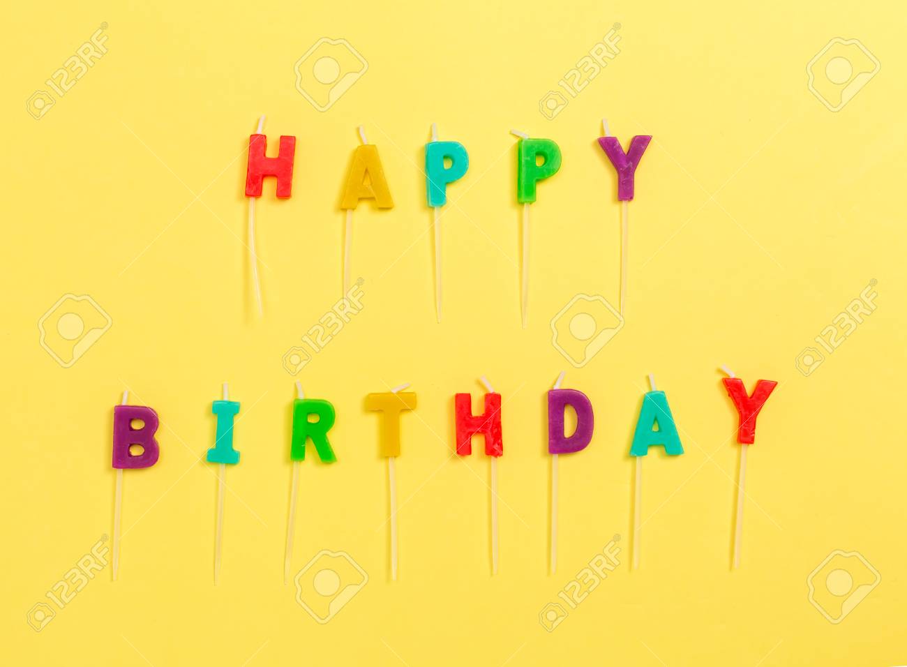 Download Happy Birthday Candles On A Yellow Paper Background Stock Photo Picture And Royalty Free Image Image 119323045 Yellowimages Mockups