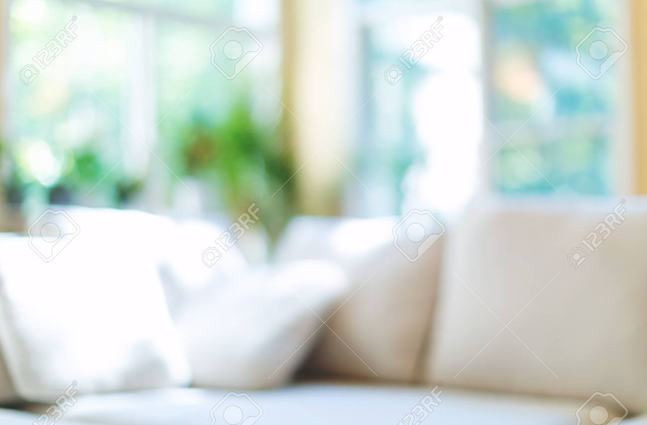 Blurred home interior background with couch and natural light - 120343621 Blurred home interior background with couch and natural light - 120343621