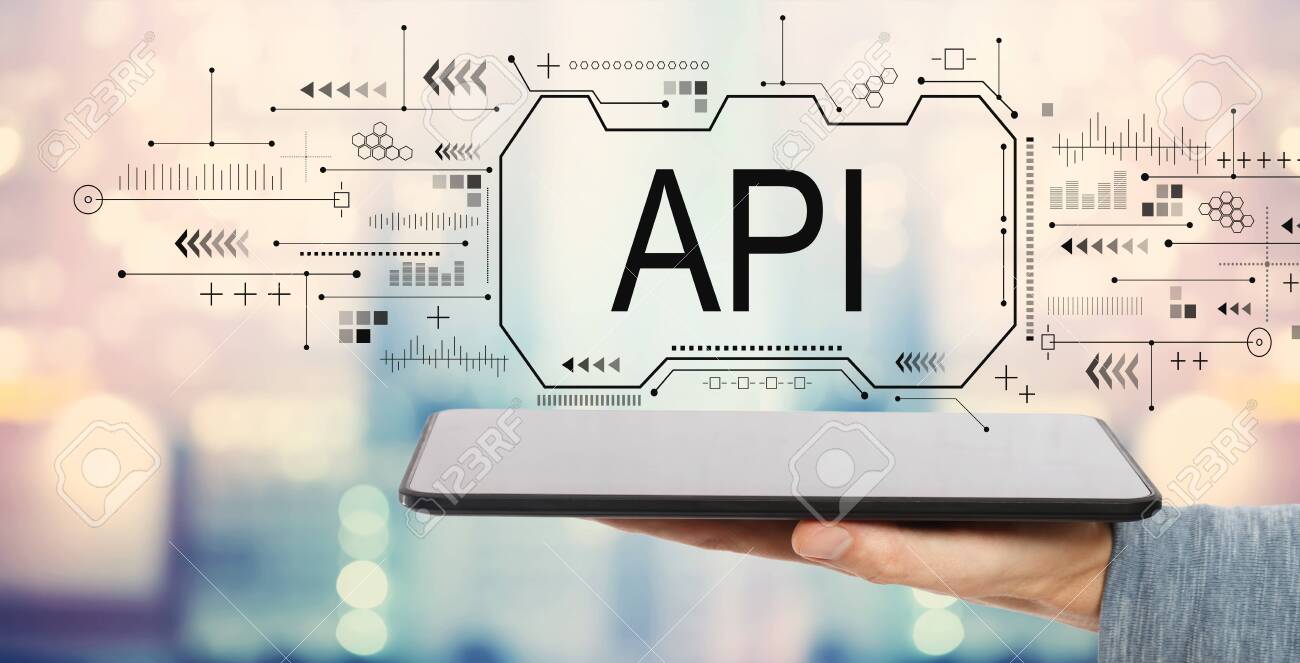 API concept with man holding a tablet computer - 122978637 API concept with man holding a tablet computer - 122978637