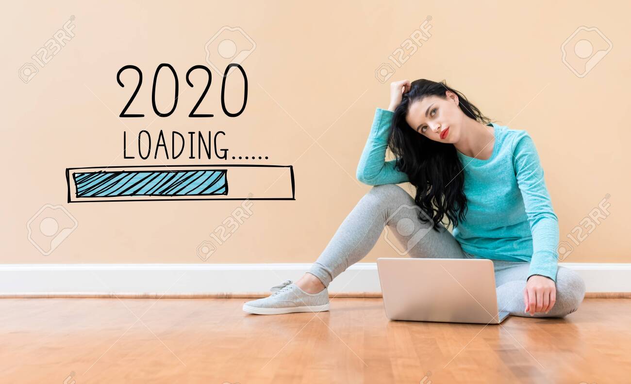 Loading new year 2020 with young woman using a laptop computer - 133756233 Loading new year 2020 with young woman using a laptop computer - 133756233