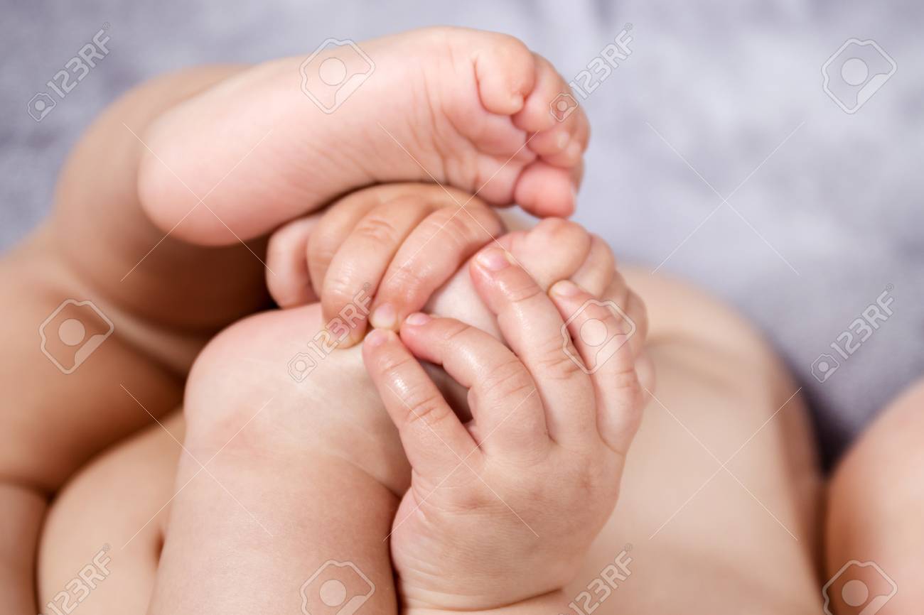 Close Up Of Baby Hands And Feet Of A Newborn Baby. Stock Photo, Picture and  Royalty Free Image. Image 91046132.