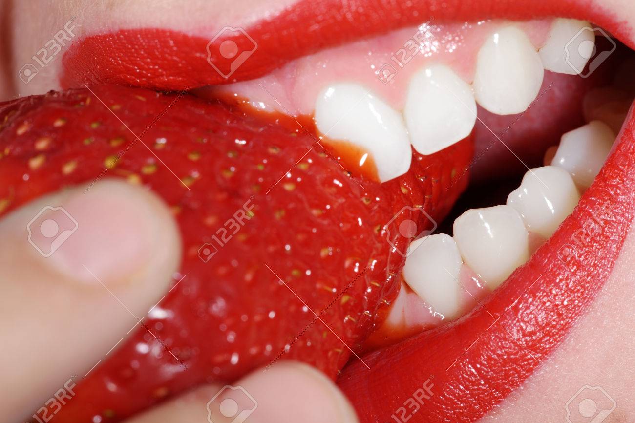 close-up mouth and white teeth and strawberry - 31587674 close-up mouth and white teeth and strawberry - 31587674