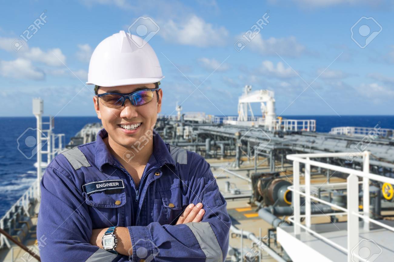 Portrait of asian engineer on the oil tanker deck. - 67607083 Portrait of asian engineer on the oil tanker deck. - 67607083