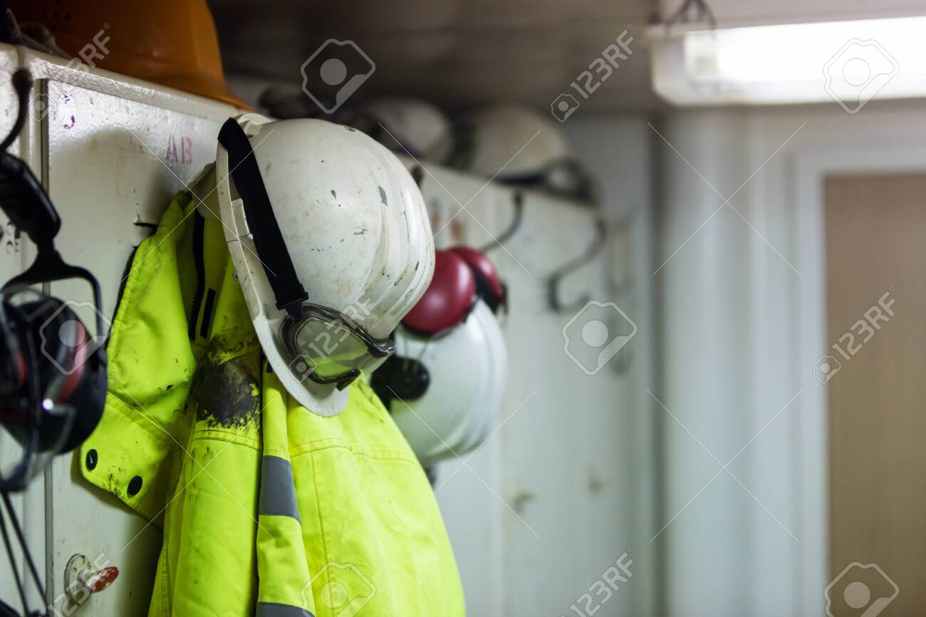 Dirty Work Clothes Hanging In The Locker Room. Stock Photo, Picture and  Royalty Free Image. Image 119080526.