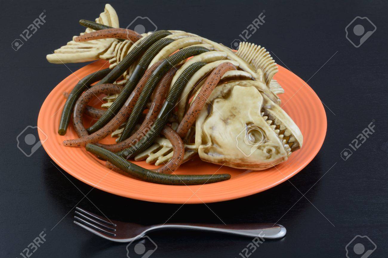 halloween dinner dish worms crawling out of fish skeleton on stock