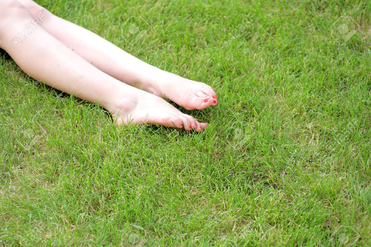 Perfect Feet In The Sun With Shaved Legs On A Meadow Of A Young Sexy Woman Perfect Feet In The Sun With Shaved Legs On A Meadow Of A Young Sexy Woman