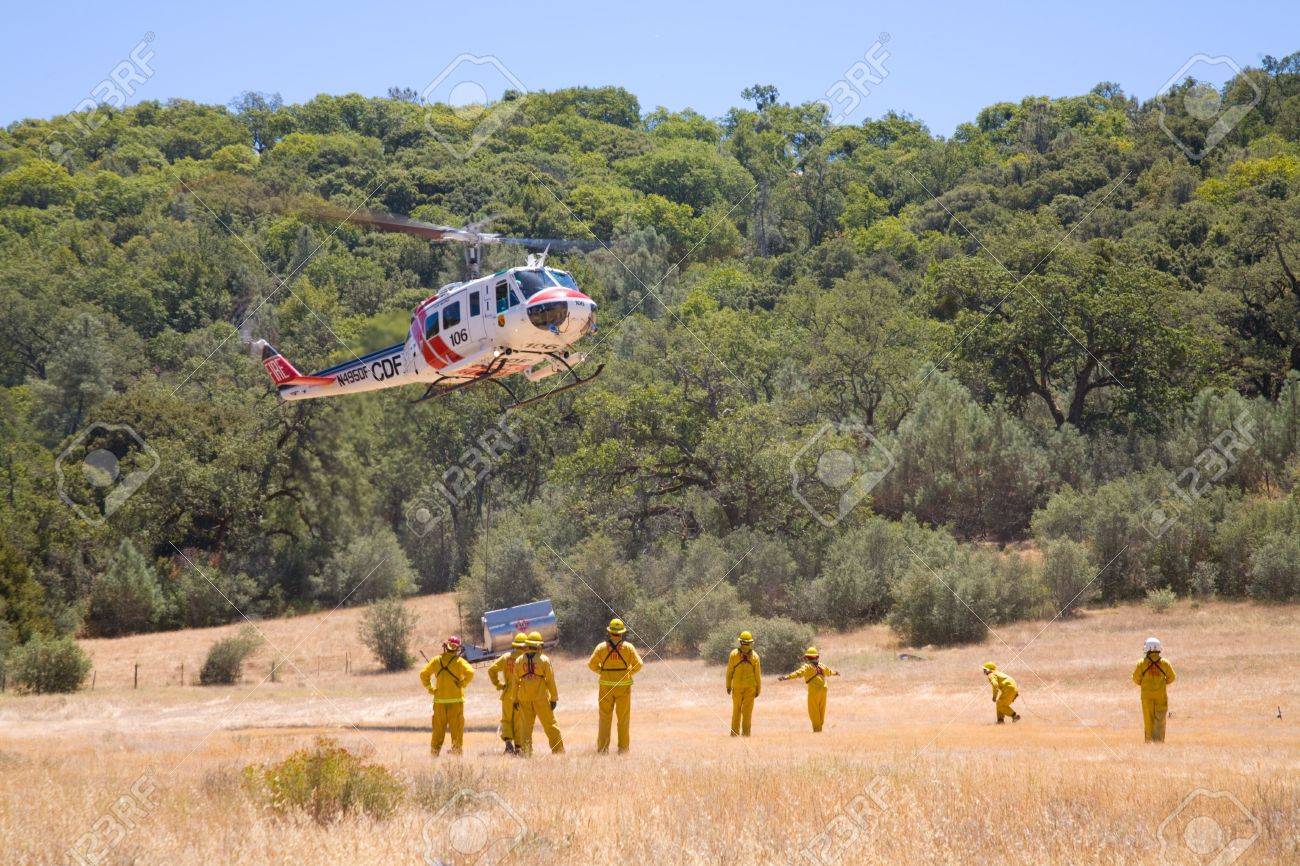 a wildland fire crew works with a helicopter stock photo picture crew works