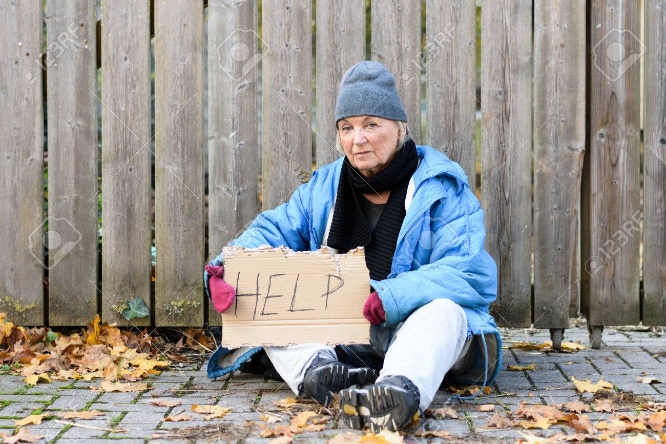 Elderly Homeless Woman Sitting On A Cobbled Sidewalk With A Hand Stock Photo Picture And Royalty Free Image Image