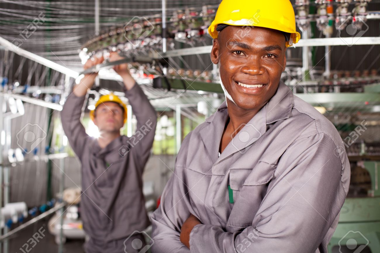african american textile worker portrait in factory stock photo