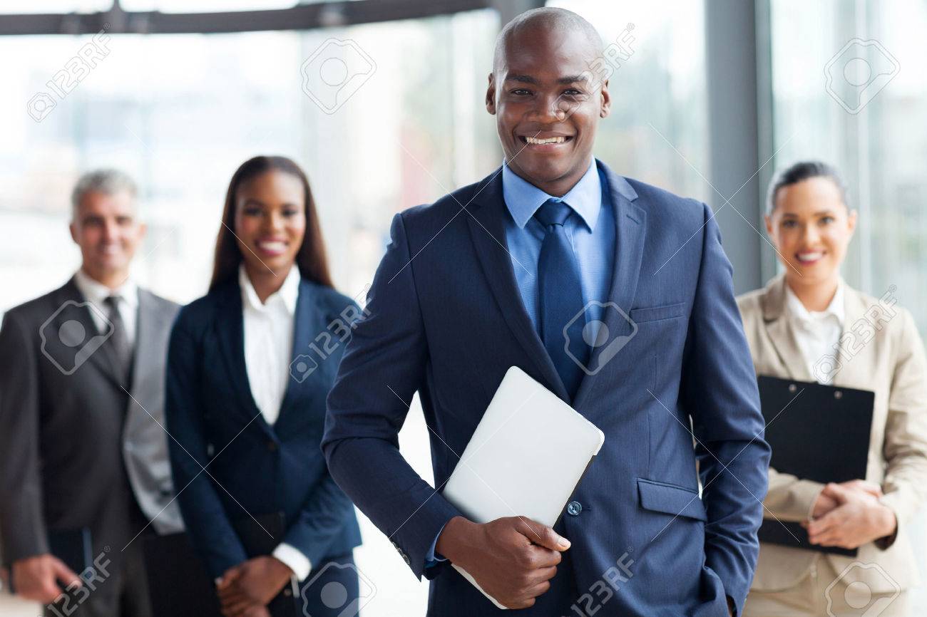 Handsome African Businessman With Group Of Businesspeople Stock Photo,  Picture and Royalty Free Image. Image 23152787., image size:1300x866