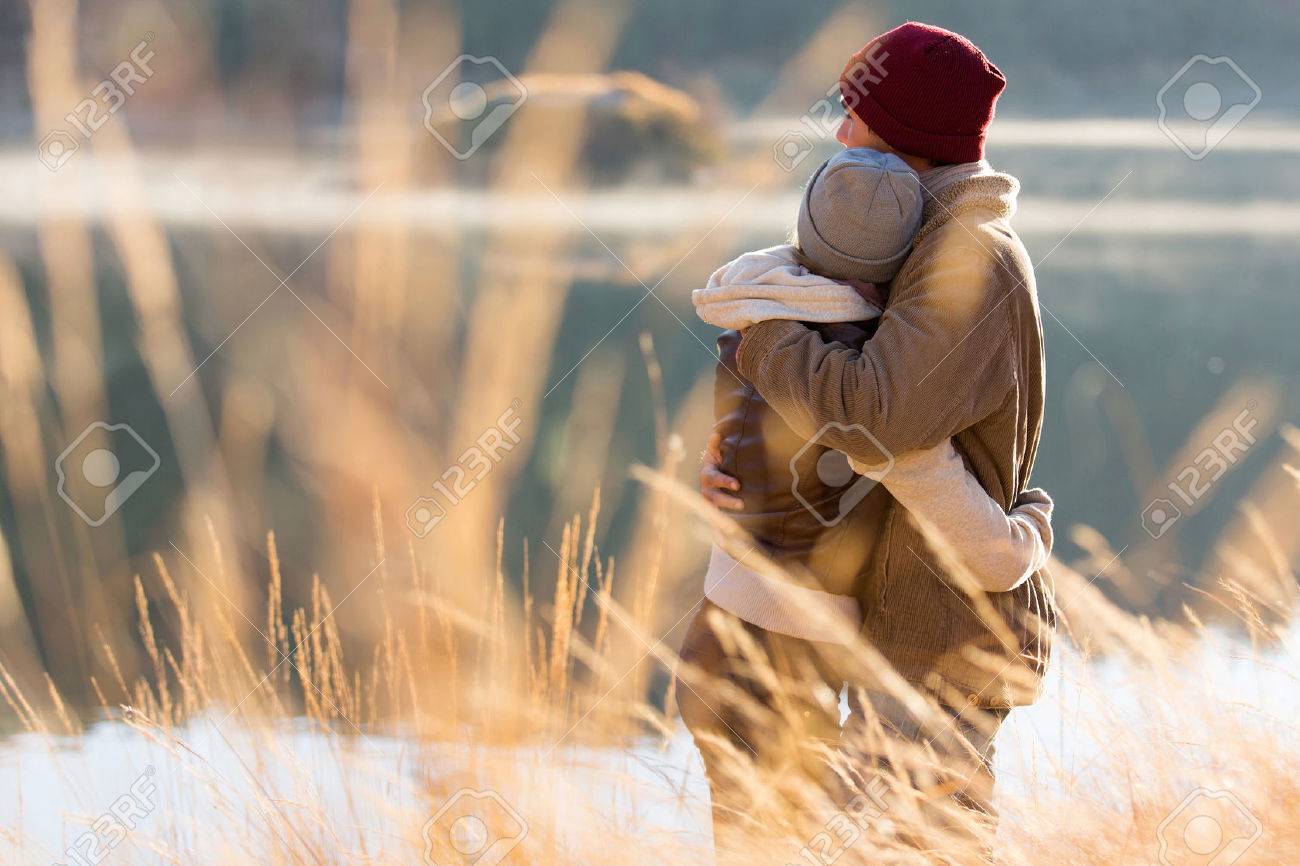 back view of lovely young couple hugging in winter - 30591338 back view of lovely young couple hugging in winter - 30591338