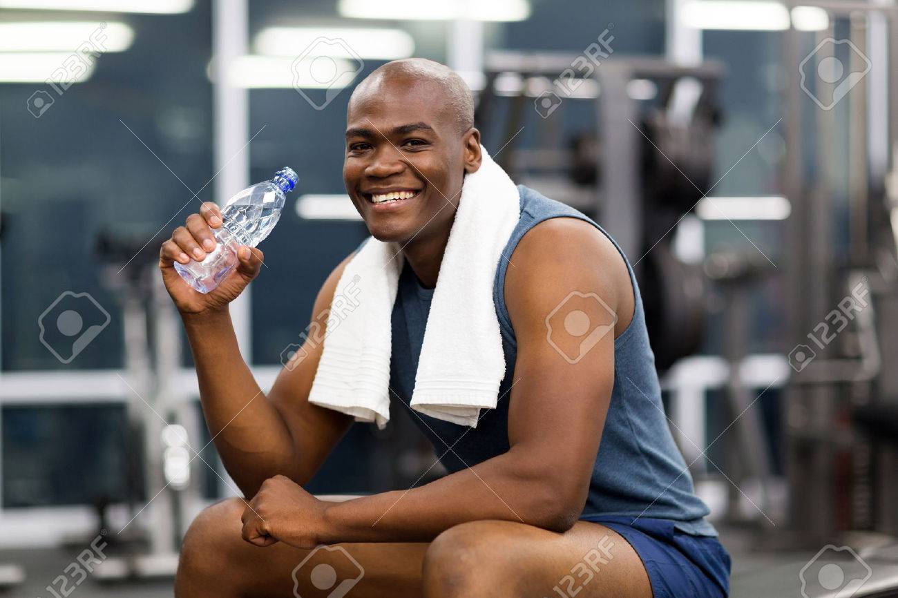 Happy Young African Man Drinking Water After Exercise Stock Photo, Picture  and Royalty Free Image. Image 34093347., image size:1300x866