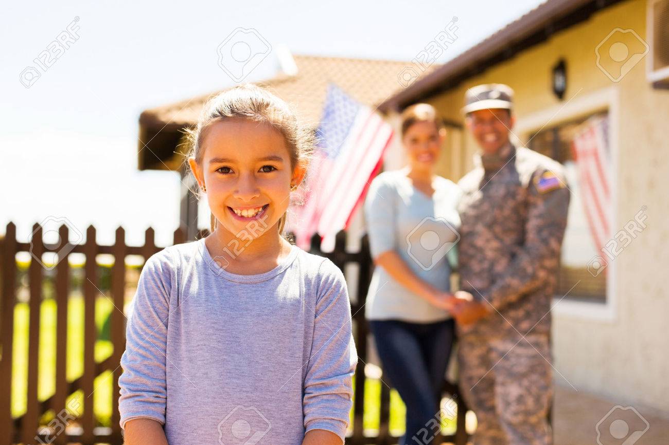 adorable little girl standing in front of parents outdoors - 50864661 adorable little girl standing in front of parents outdoors - 50864661
