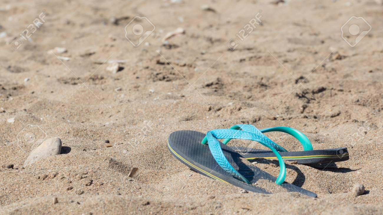 flip flops in the sand