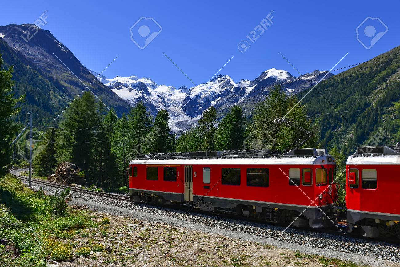 Swiss mountain train Bernina Express crossed Alps with glaciers in the backgroundin the summer - 64502498 Swiss mountain train Bernina Express crossed Alps with glaciers in the backgroundin the summer - 64502498