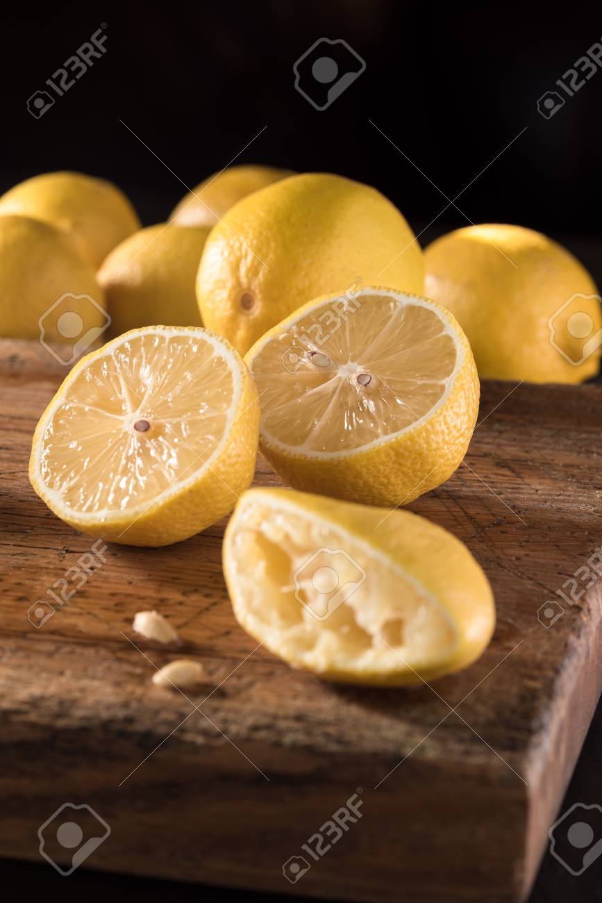 cut and squeezed lemons for making lemonade making lemonade