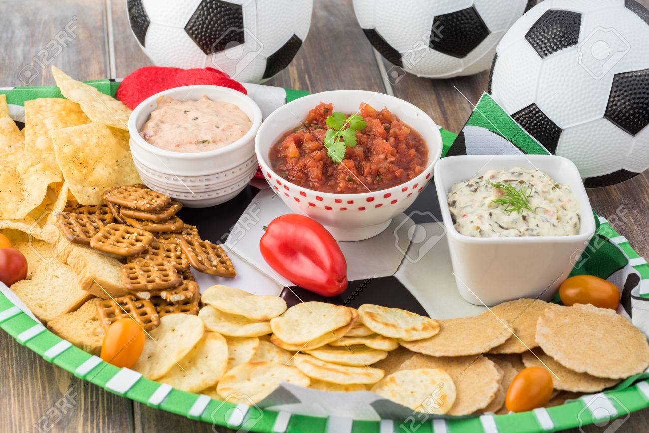 close up of party table for soccer game with variety of snacks