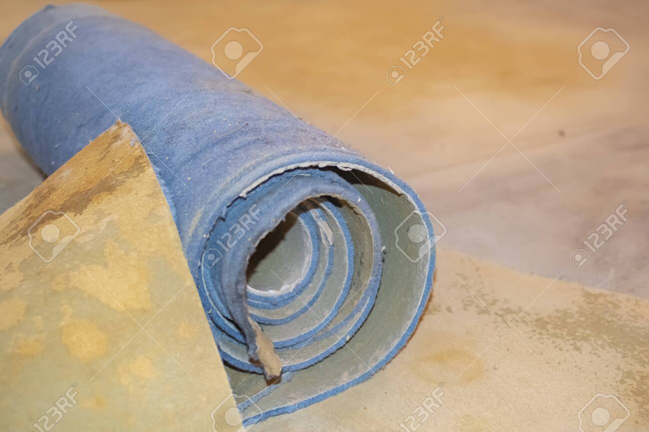 Carpet Leftovers In A Living Room After Being Removed To Lay