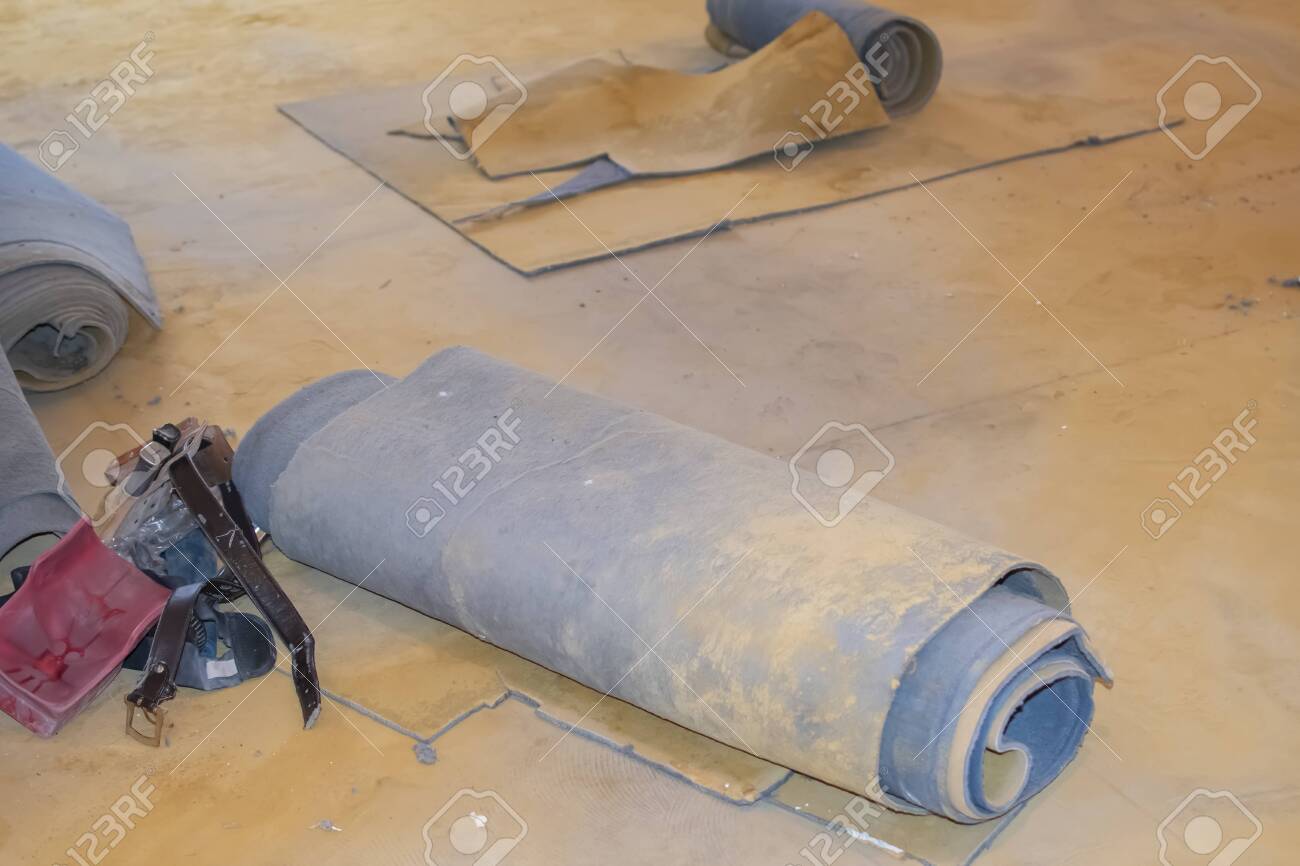 Carpet Leftovers In A Living Room After Being Removed To Lay
