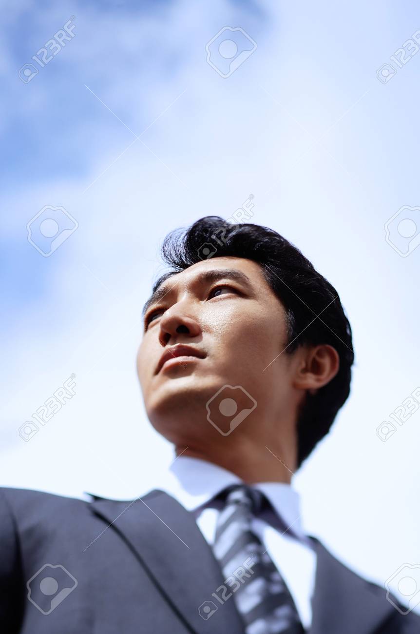 Businessman Looking Away Head Shot Low Angle View Stock Photo