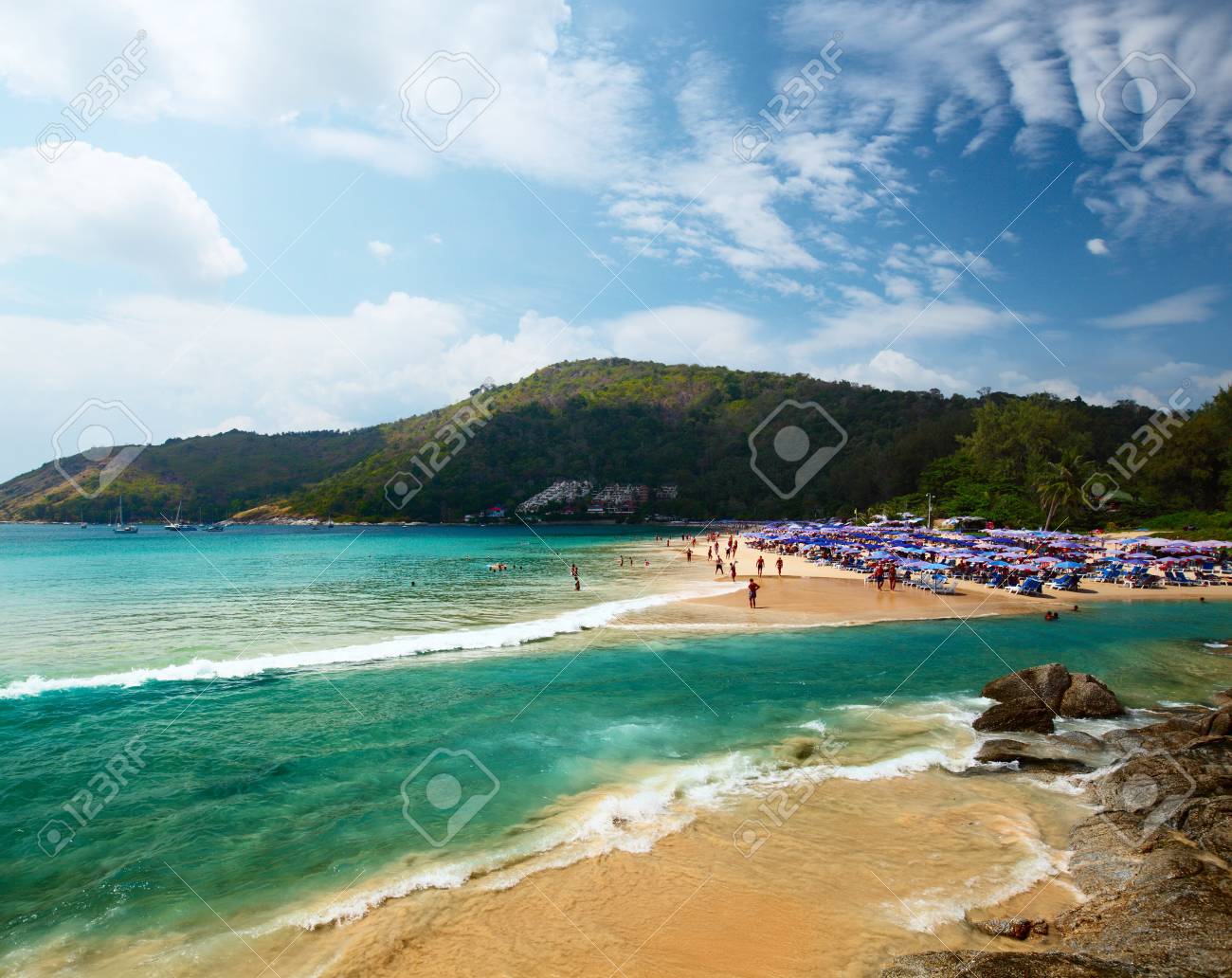 tropical beach with a lot of umbrellas nai harn beach phuket