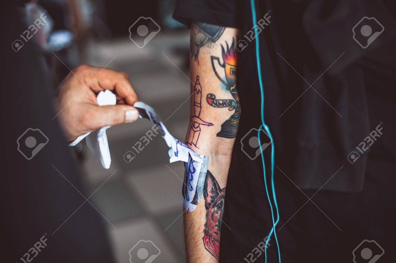 Master Tattoo Artist Showing Process Of Transfer Tattoo Sketch