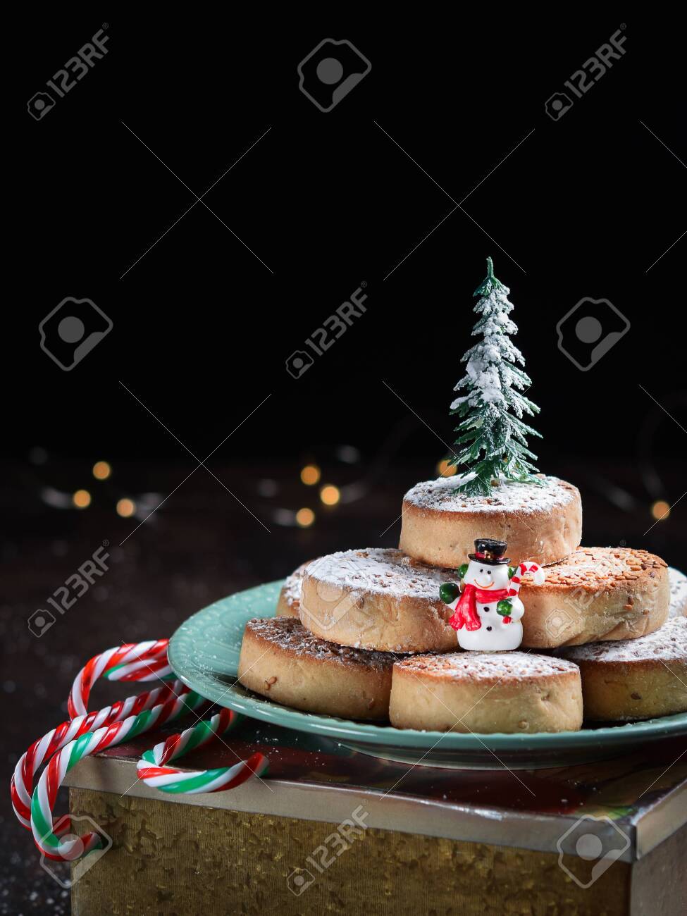 Typical Spansih Christmas Cookies Polvorones, mantecados, with almonds on dark wooden background with space for text. Christmas and New Year celebration concept. Holiday decoration. - 129540455 Typical Spansih Christmas Cookies Polvorones, mantecados, with almonds on dark wooden background with space for text. Christmas and New Year celebration concept. Holiday decoration. - 129540455