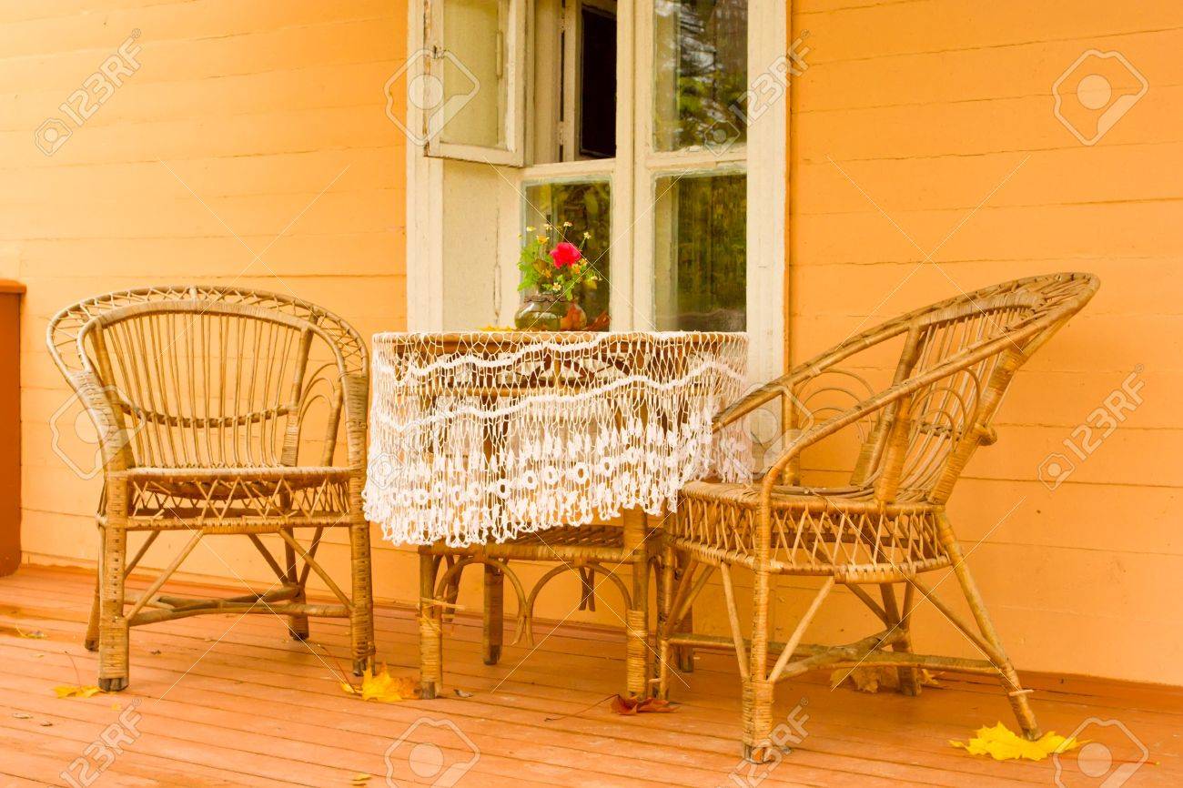 cozy veranda with wicker garden furniture in a traditional russian village house stock photo - Garden Furniture Traditional cozy veranda with wicker garden furniture in a traditional russian village house stock photo - Garden Furniture Traditional