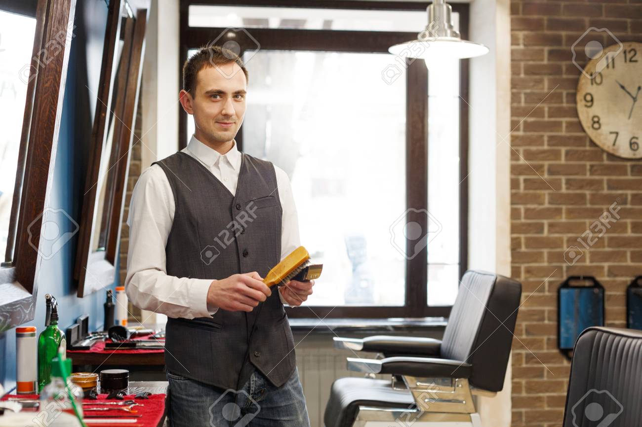 professional hairstylist in male barbershop stock photo 83994945