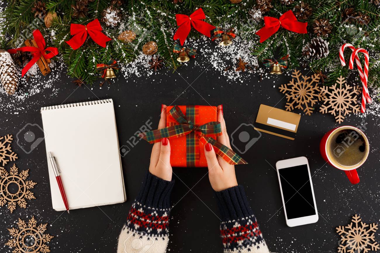getting online delivery of christmas gift woman holding holiday