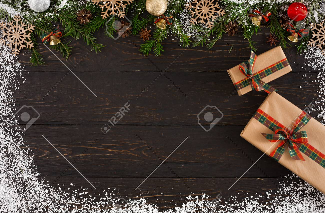 Christmas decoration, gift boxes in craft paper and garland frame..