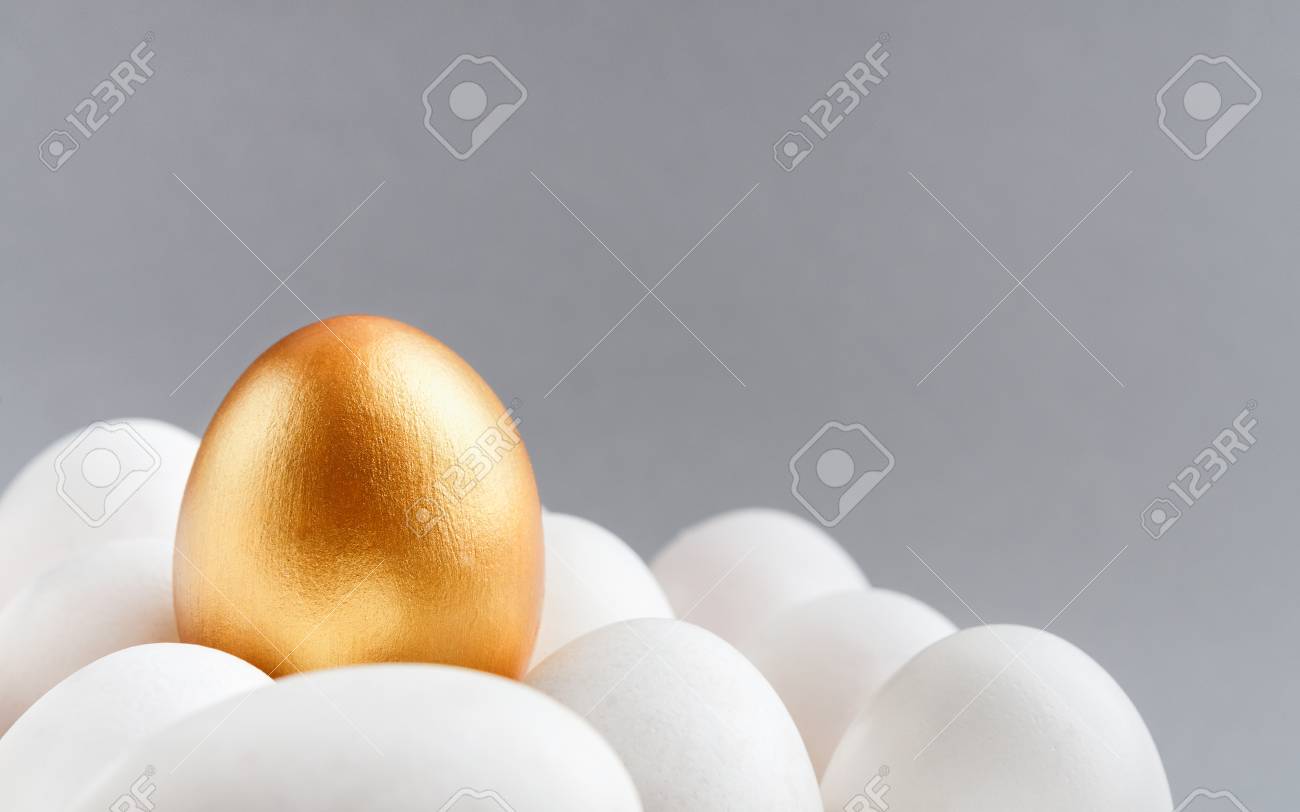 Uniqueness Success And Leadership One Golden Egg On Top Of Group Of White Eggs Grey Background Copy Space Stock Photo Picture And Royalty Free Image Image