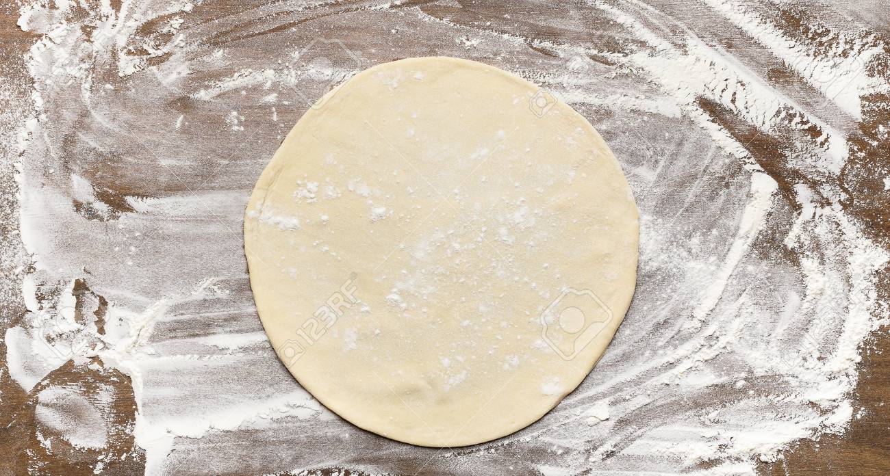 Raw Rolled Out Pizza Dough On Floured Surface Top View Stock Photo Picture And Royalty Free Image Image 118461081