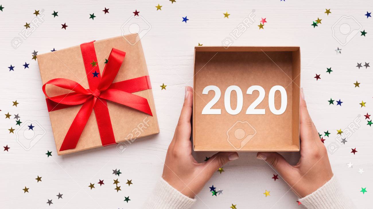 Download Womans Hand Holding Open Gift Box With 2020 Number On White Christmas Stock Photo Picture And Royalty Free Image Image 122404028 PSD Mockup Templates